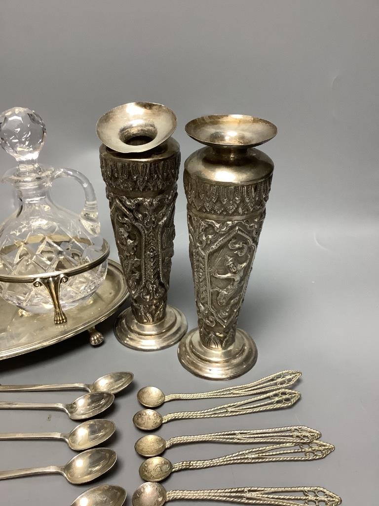 A pair of Thai Sterling silver specimen vases, a white metal ewer, a 'betel nut' box and cover, a set of silver teaspoons with elephant finials and sundries